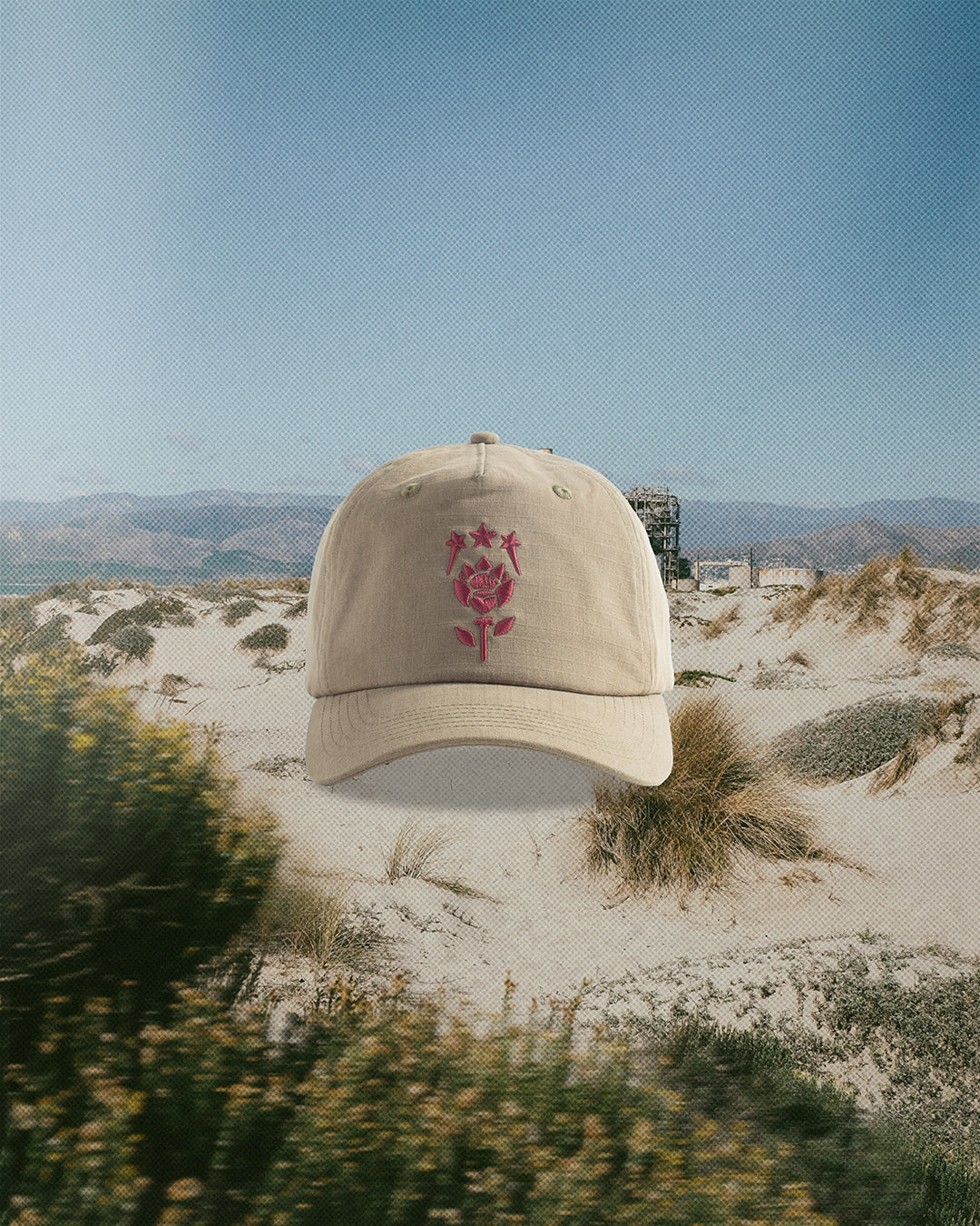 Dune Hat lifestyle shot — olive cap styled in Fiori Golf lookbook