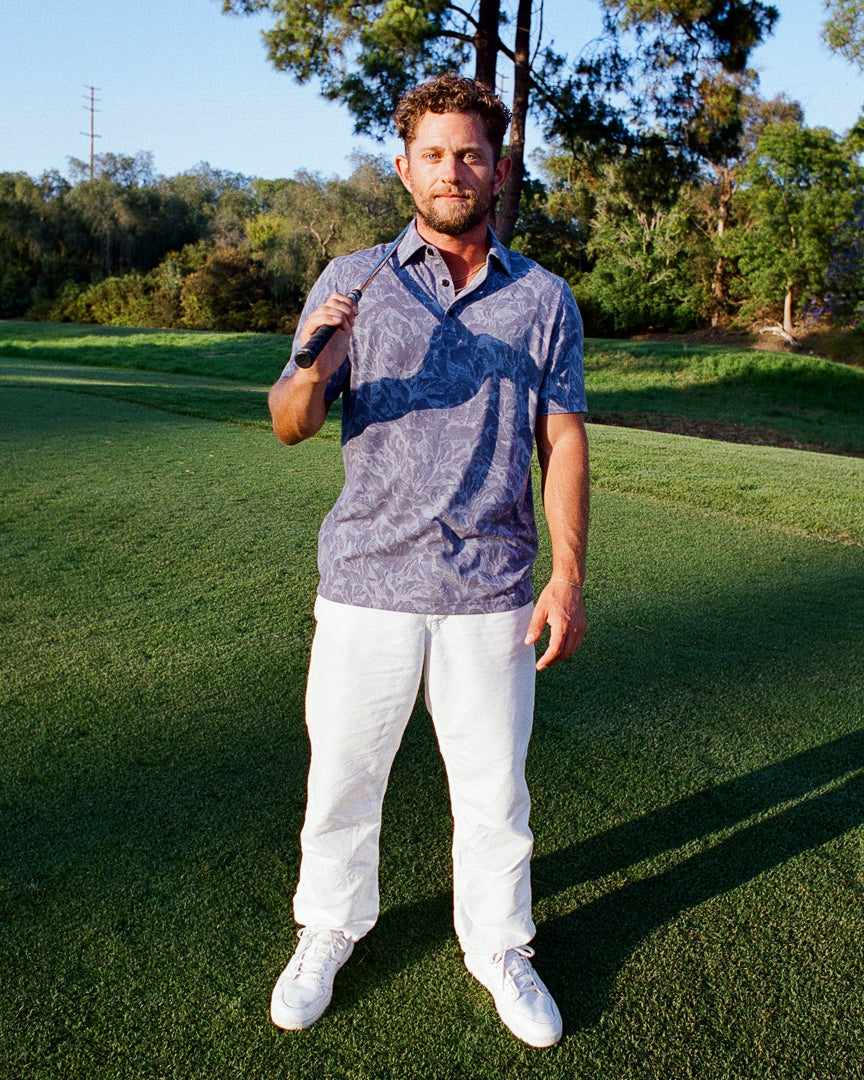 Phantom Polo lifestyle shot — blue graphite polo in lookbook by Fiori Golf