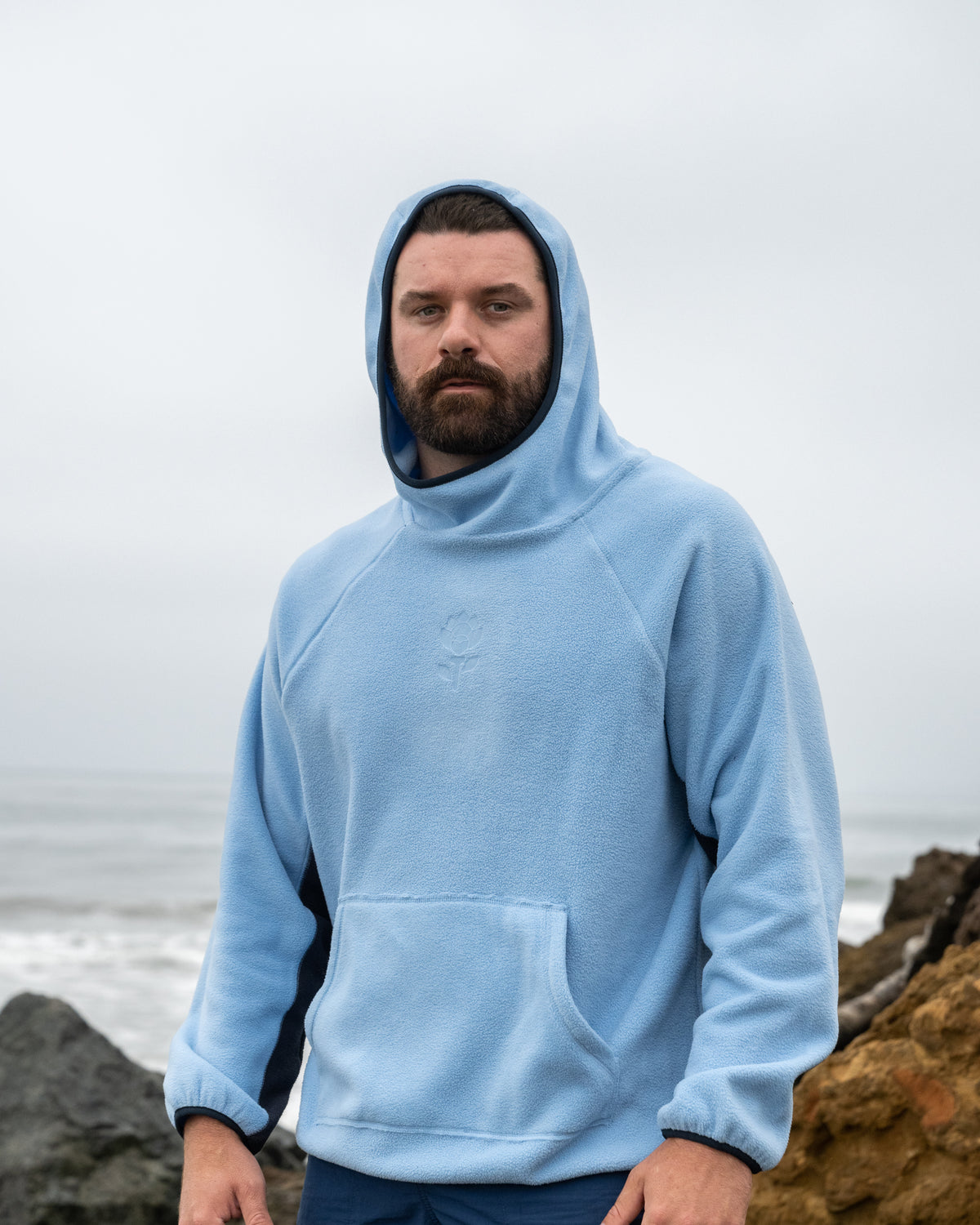 Tech Hoodie lifestyle shot — sky blue golf hoodie styled by Fiori Golf