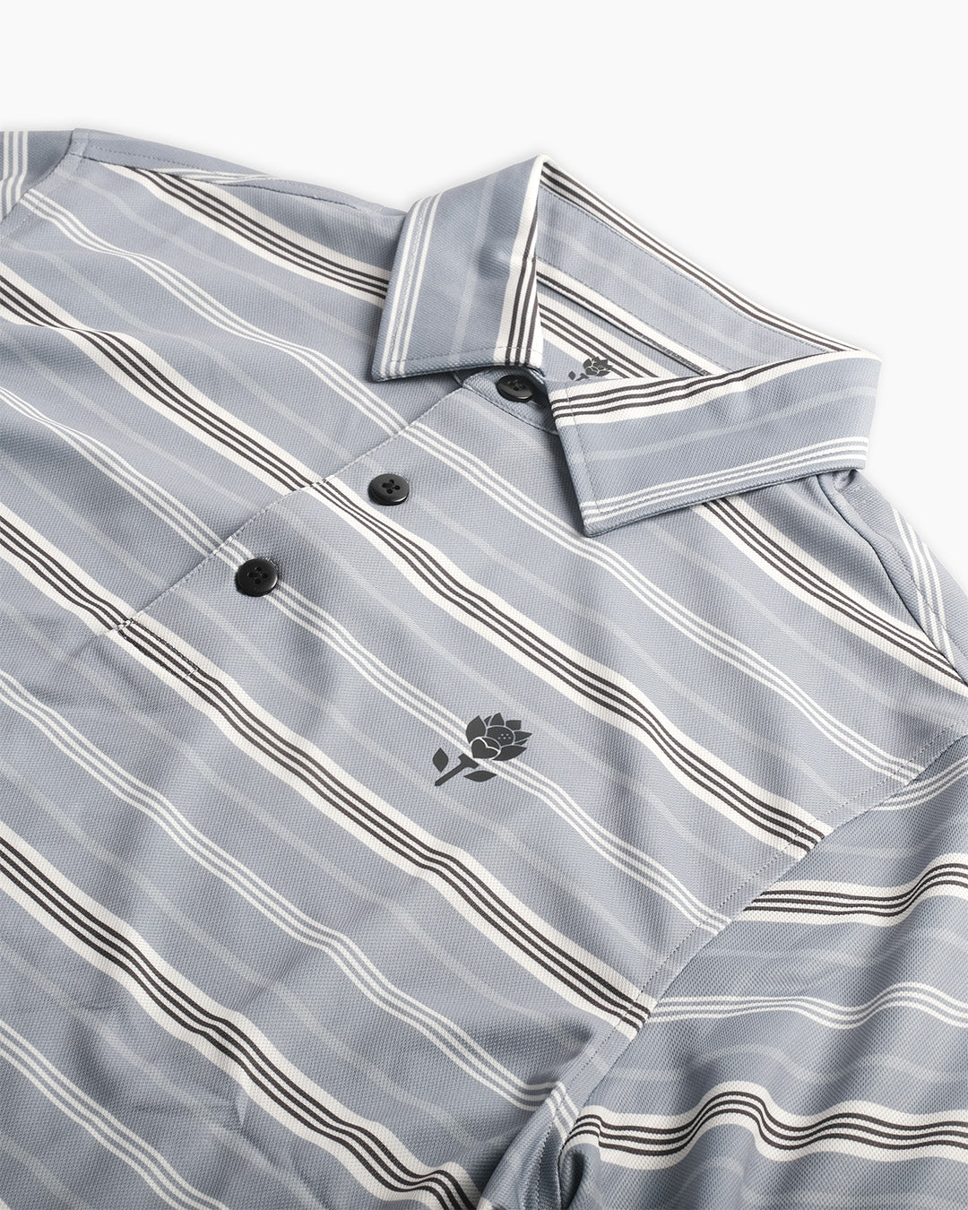 Channel Polo collar detail — subtle stripe collar on blue polo by Fiori Golf